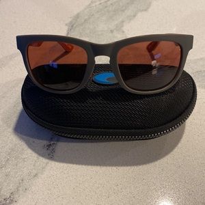 Costa polarized sunglasses. Gray outter with orange inside. Excellent condition!